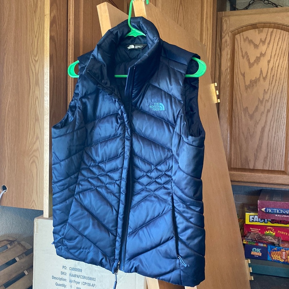 The North Face blue puffer vest